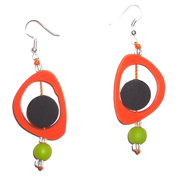 Bold orange ovoid resin earrings with black circles, accented with lime green beads available at Cerulean Arts.  