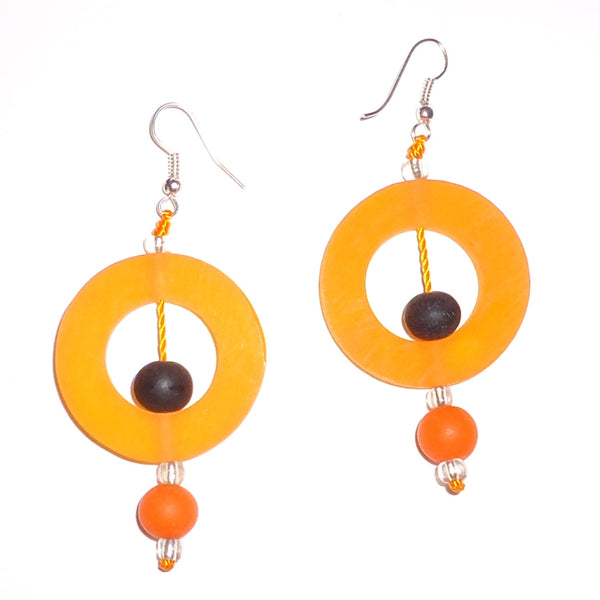 Bold melon circular resin earrings with contrasting black and orange beads available at Cerulean Arts.