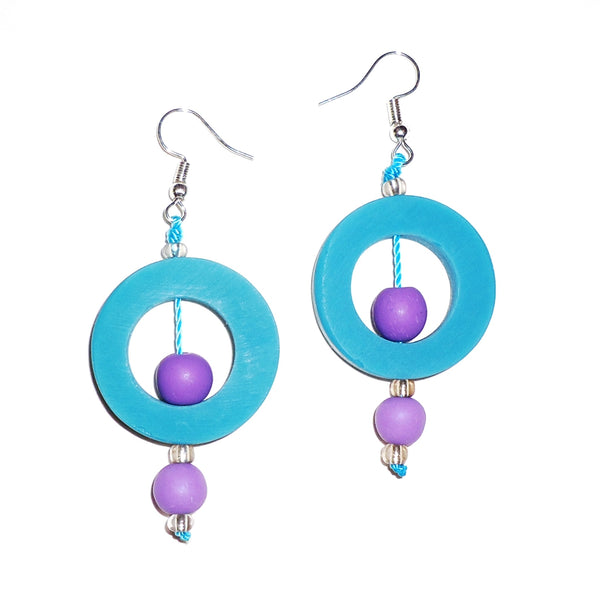 Cerulean blue circular resin earrings with contrasting lavender beads available at Cerulean Arts. 