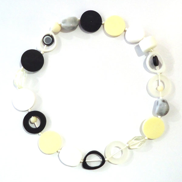 Bold handmade resin necklace with a mix of large, eye-catching beads in black and white available at Cerulean Arts.  