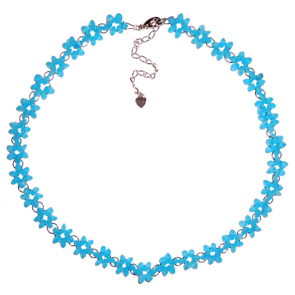Necklace with frosted blue glass delicately strung in a flower pattern on nylon cording available at Cerulean Arts.