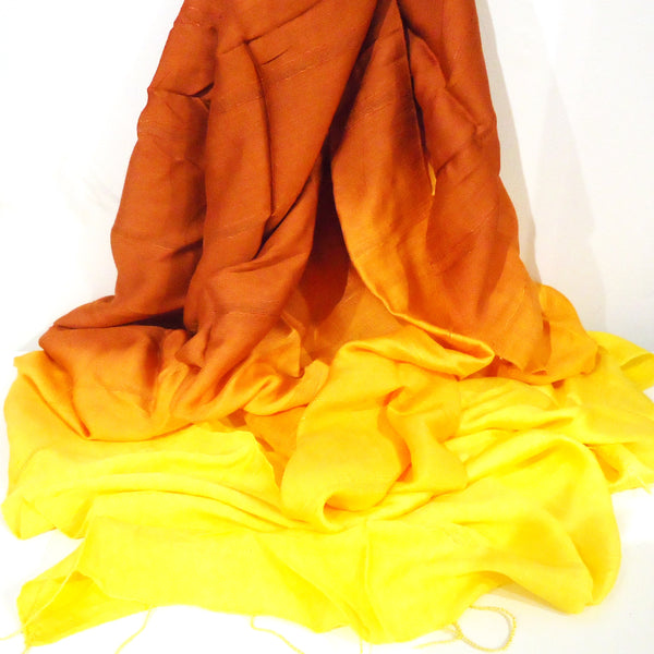 Silk and cotton ombre scarf in gradating shades of yellow to orange available at Cerulean Arts.