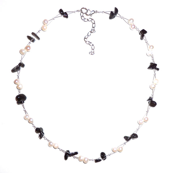 White pearl and onyx chip necklace on wire cord available at Cerulean Arts. 
