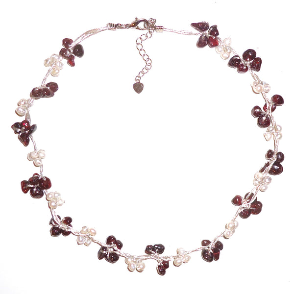White pearl and garnet chip necklace on silk cord available at Cerulean Arts.  