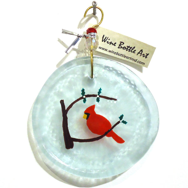 Pale blue glass suncatcher with red bird and white berries made from a recycled wine bottle available at Cerulean Arts. 