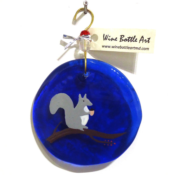 Cobalt blue glass suncatcher with squirrel made from a recycled wine bottle available at Cerulean Arts. 