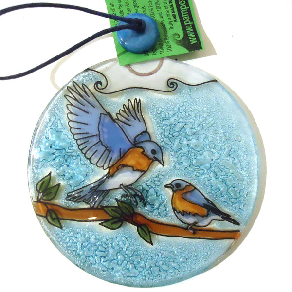 Fused glass suncatcher featuring blue birds on a branch available at Cerulean Arts. 