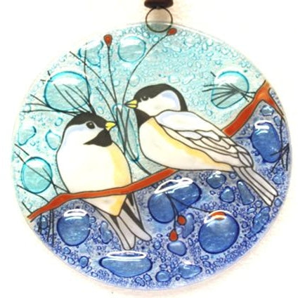 Fused glass suncatcher featuring two chickadees on a branch available at Cerulean Arts. 