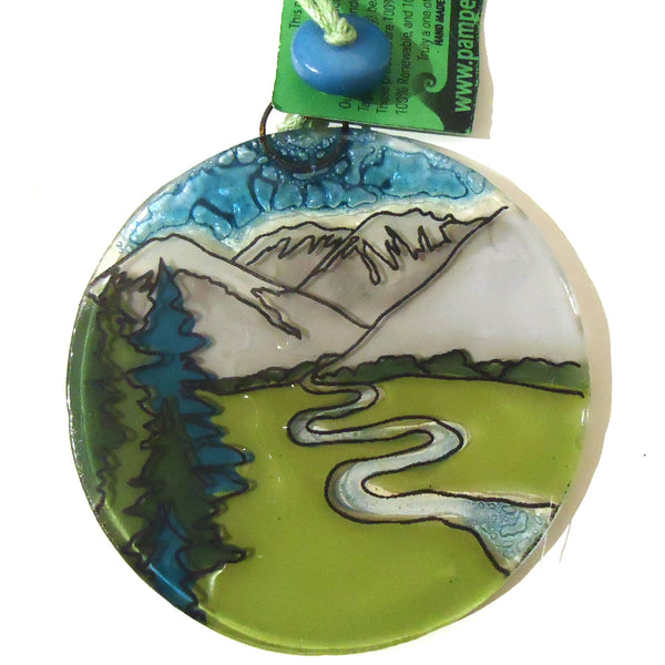 Fused glass suncatcher featuring a stream flowing through a mountain view available at Cerulean Arts.