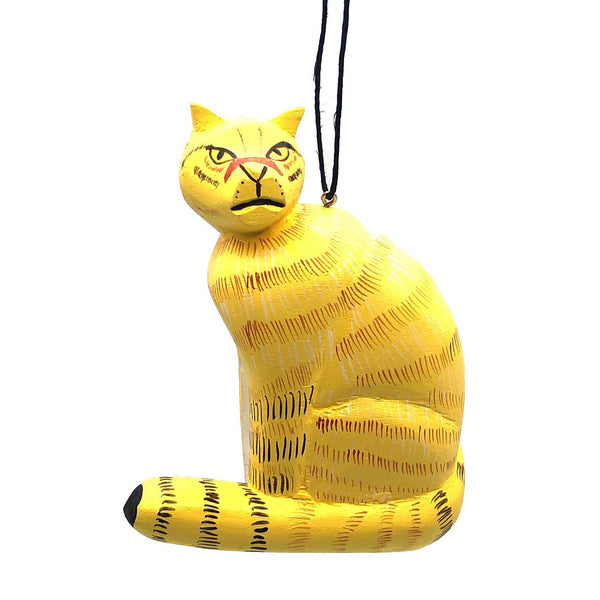 Balsa wood yellow cat ornament hand-carved and painted with non-toxic acrylic paints by a cooperative of artisans on Isla Solentiname, Nicaragua, available at Cerulean Arts.