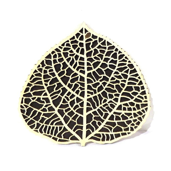 Laser-cut aspen leaf wood trivet by veteran Robert E. Jones of Baltic by Design, available at Cerulean Arts. 