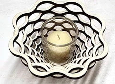 Laser-cut votive holder created from one flat sheet of wood by veteran Robert E. Jones of Baltic by Design, available at Cerulean Arts. 